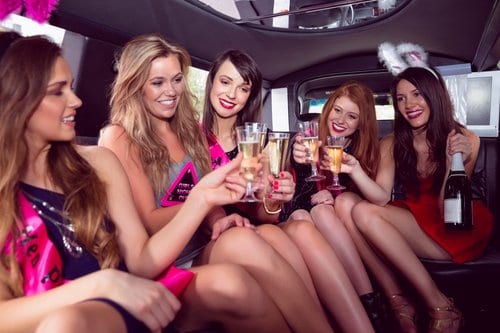crown prestige limousines chauffeur cars melbourne fleet customers having a hens party in a stretch limousine